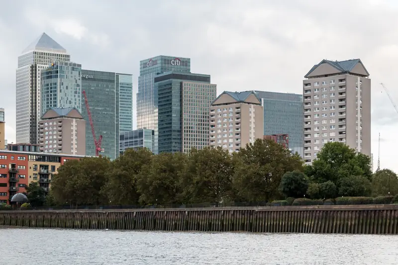 Office towers of Canary Wharf in London seen across the River Thames