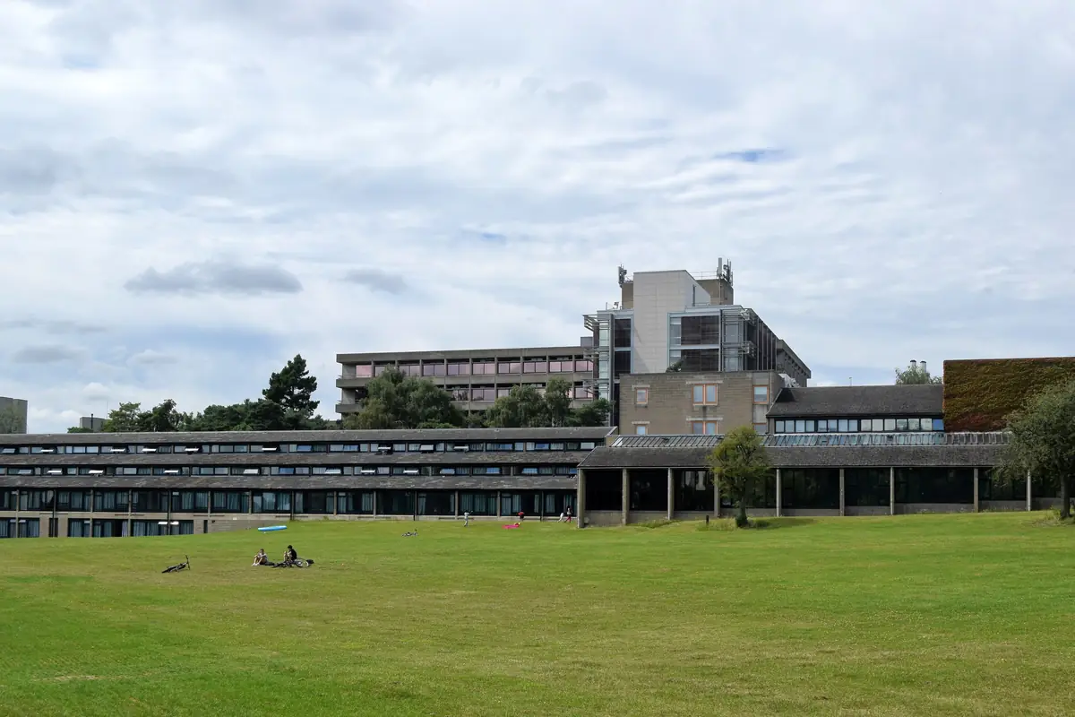 Low-rise university accommodation blocks behind a wide lawn at the University of East Anglia